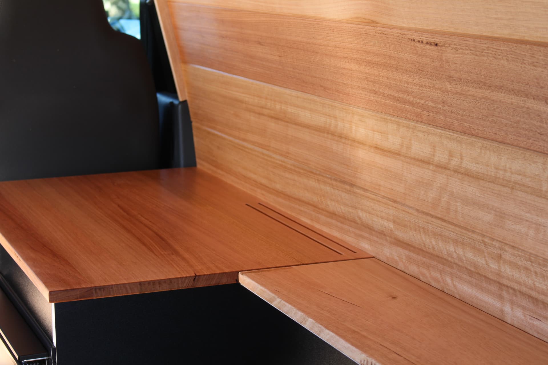 Hiace 200 Series Weekender — Hardwood benchtop meeting the timber wall