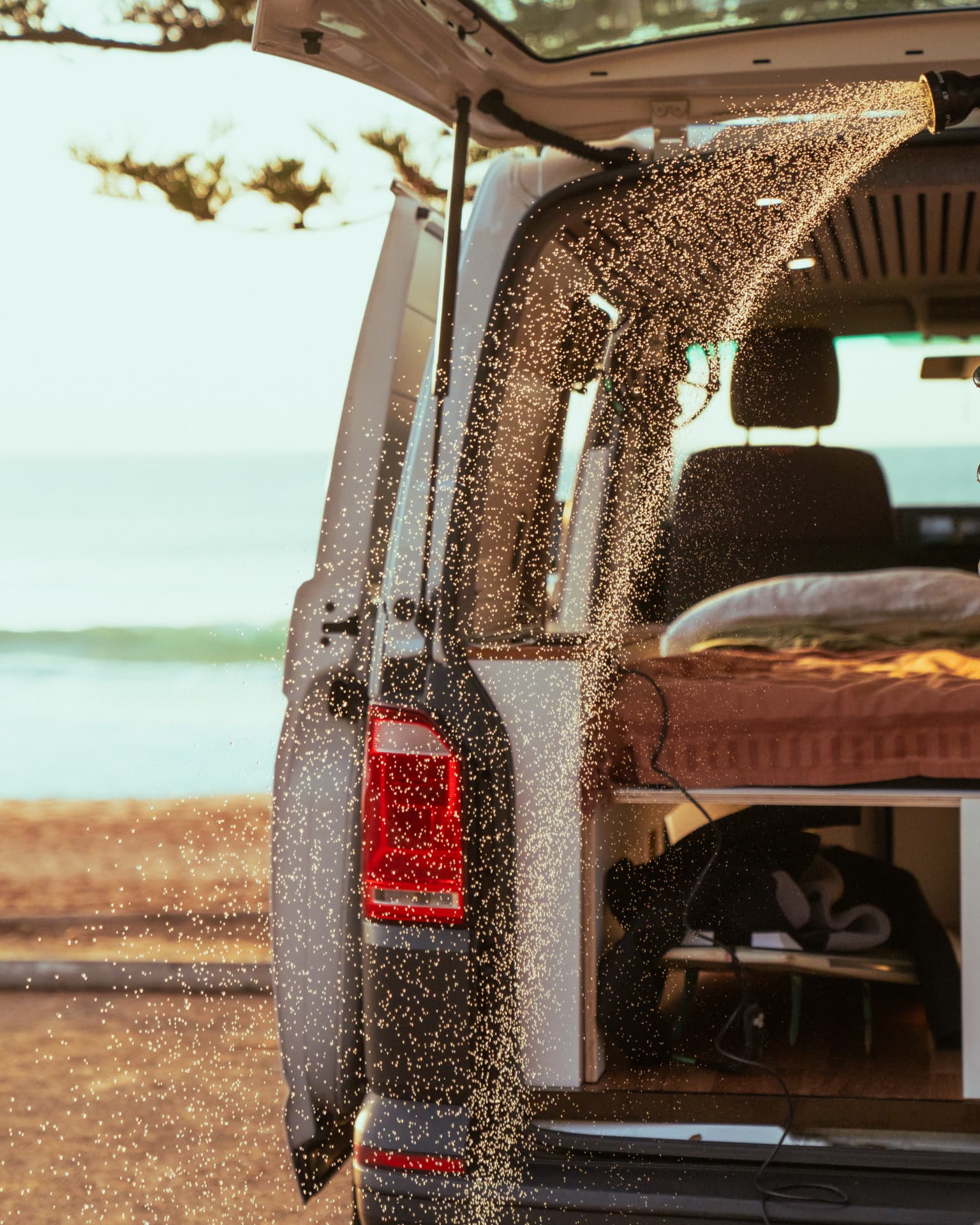 VW Transporter — Rear shower running at golden hour