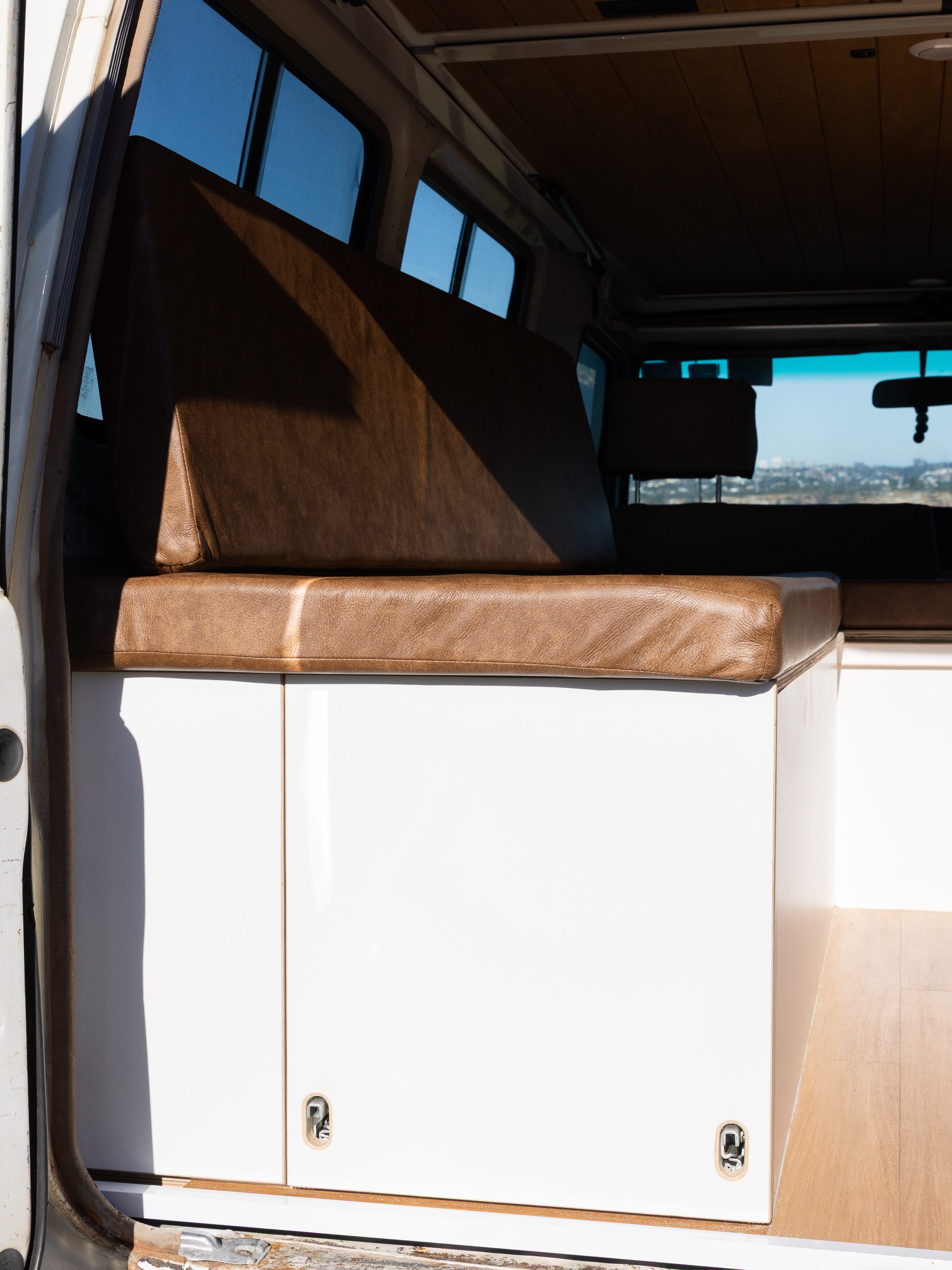 Toyota Troop Carrier — Leather-topped bench seat over storage