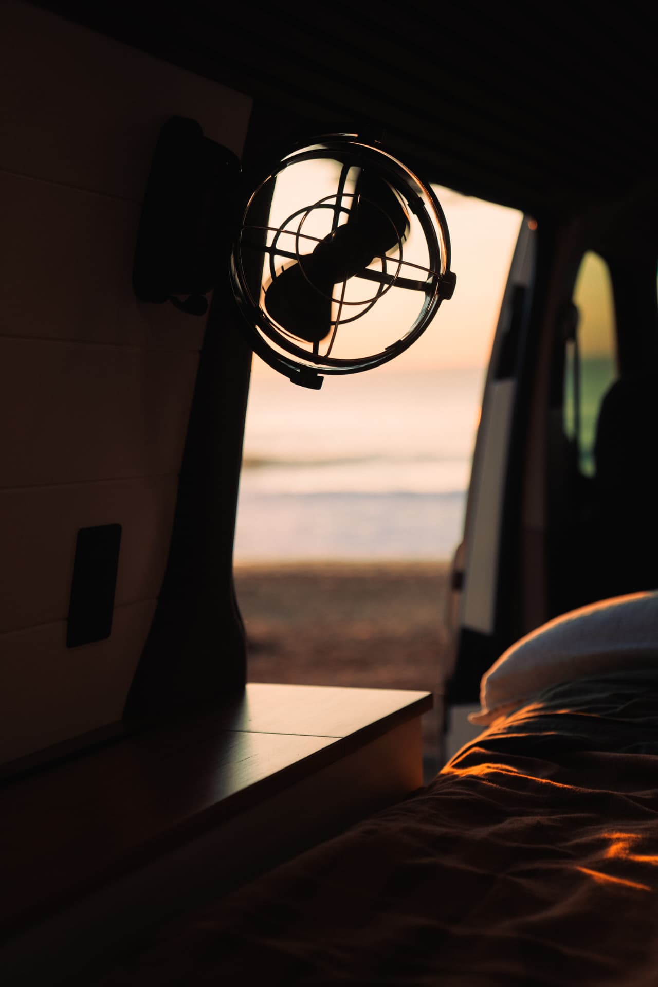 VW Transporter — Sirocco fan silhouetted against the sunrise
