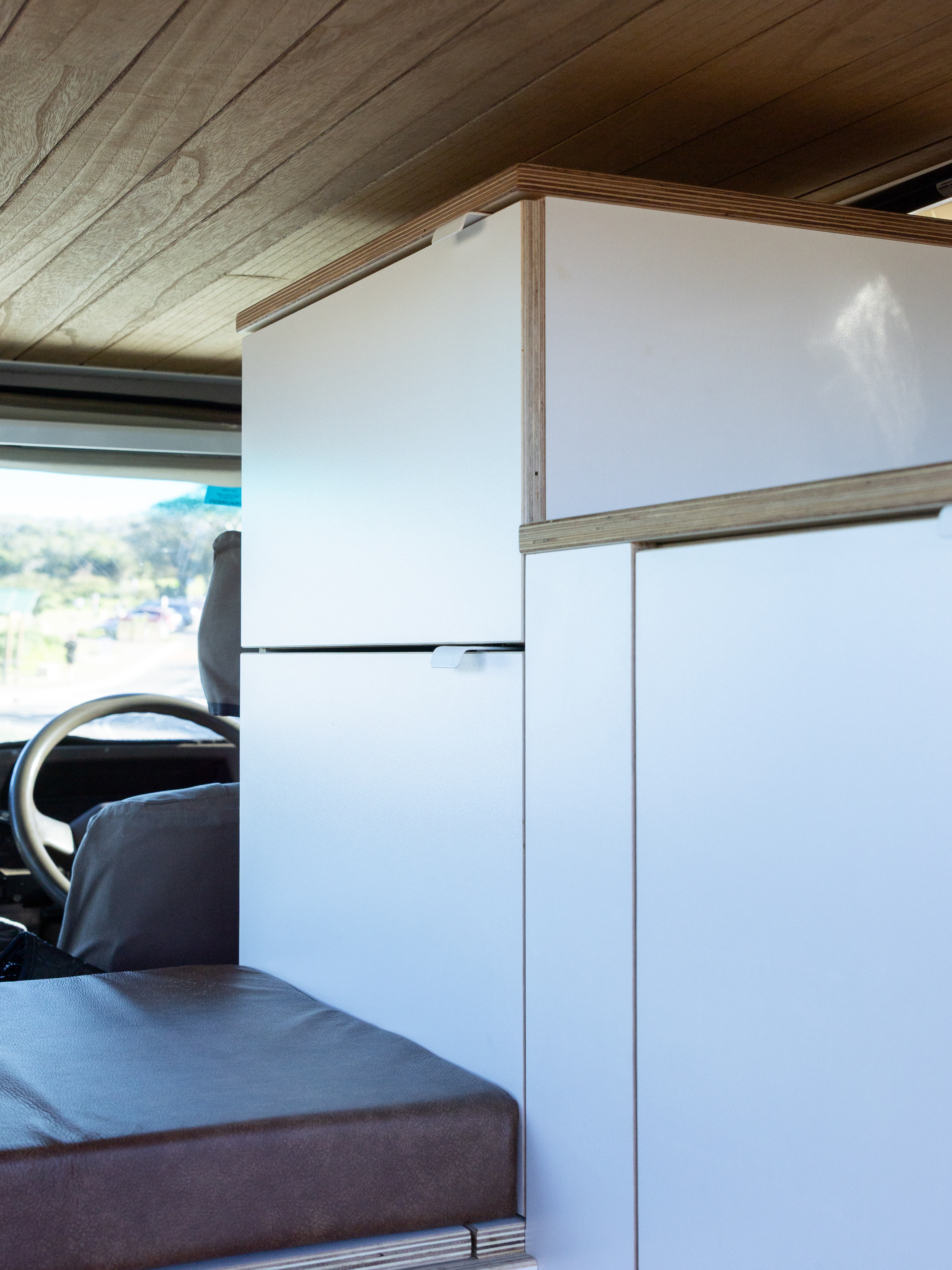 Toyota Troop Carrier — Cabinet run and fridge beside the cab