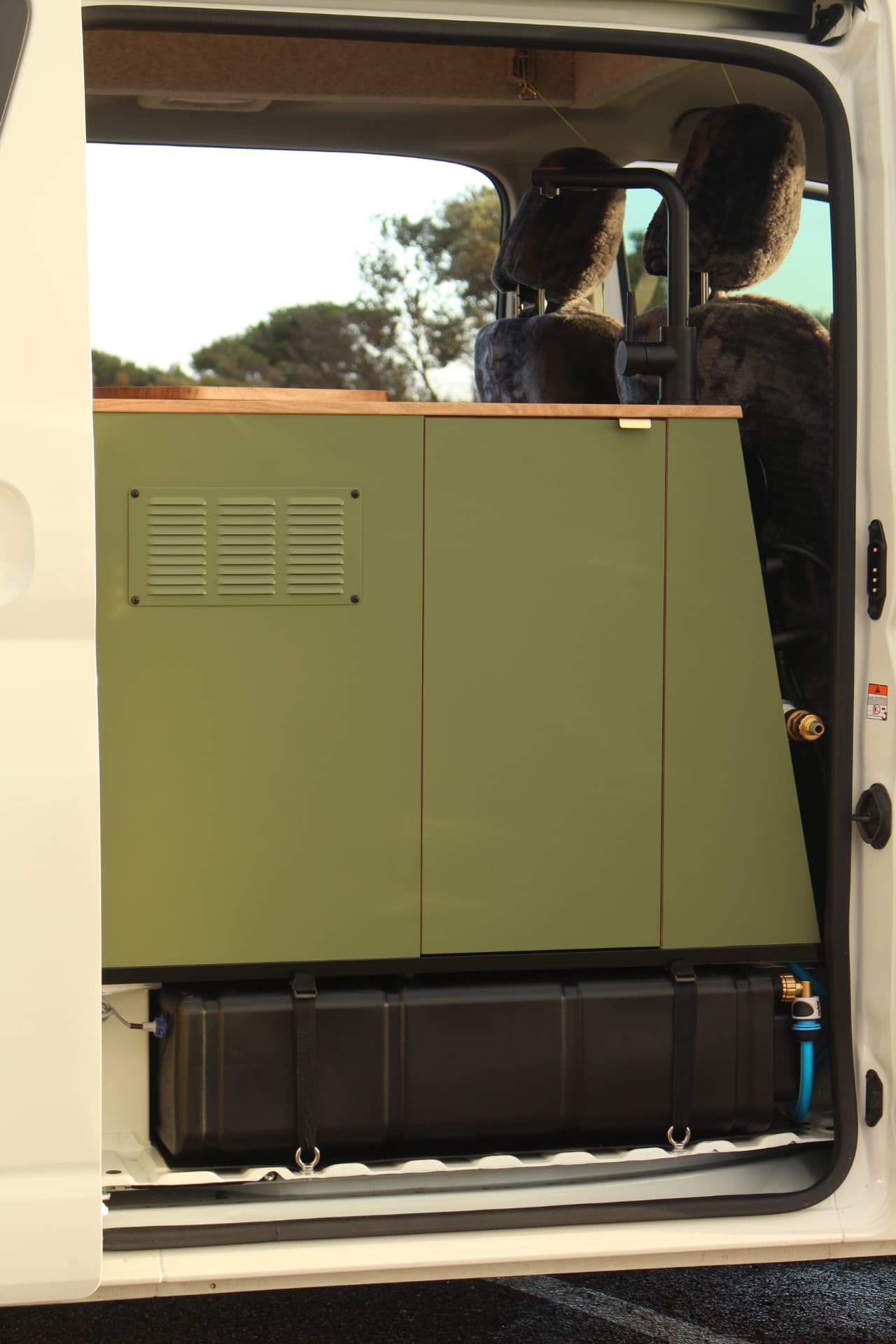 Toyota Hiace 300 Series — Vented cabinet door and water inlet detail