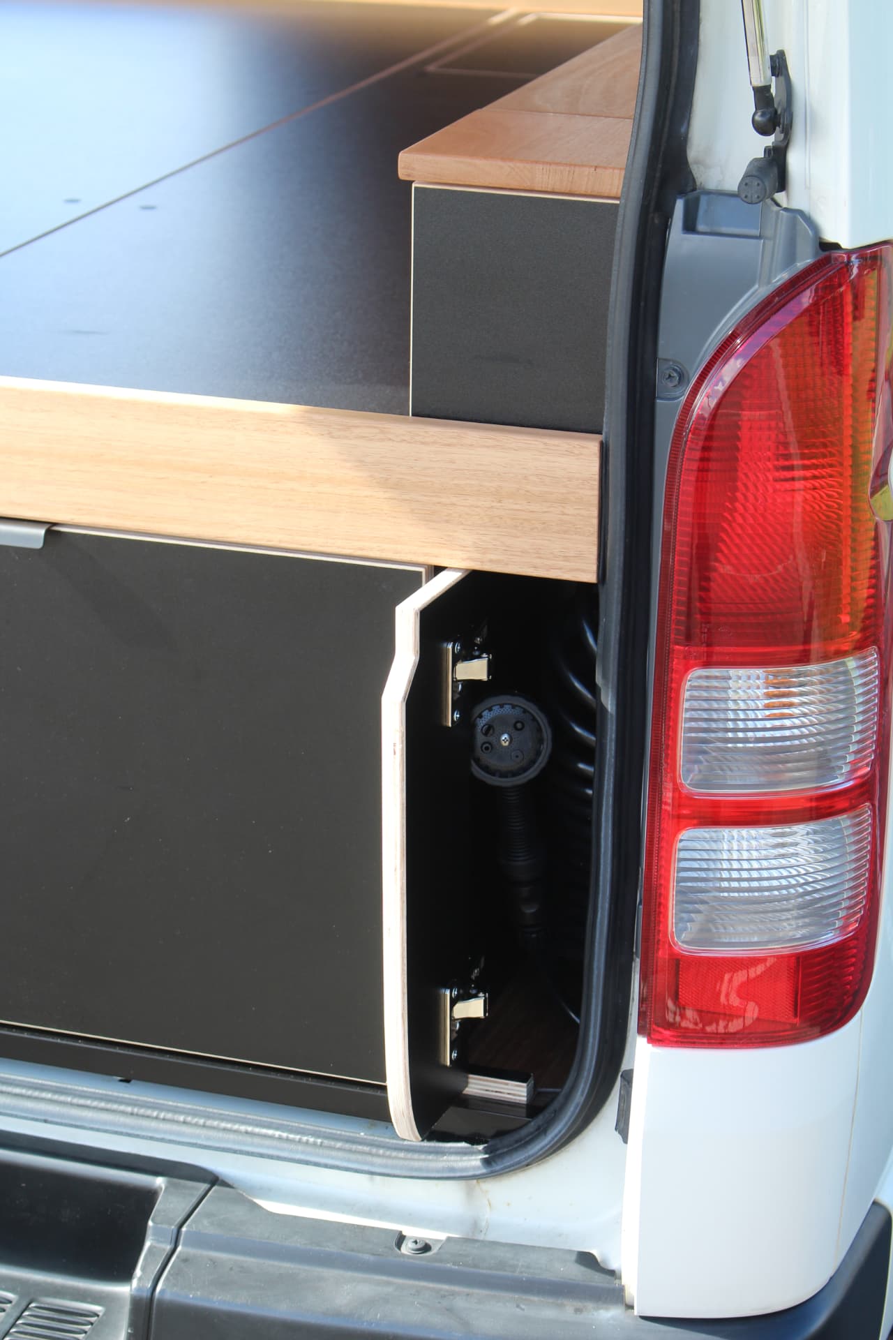 Hiace 200 Series Weekender — Rear corner detail — hardwood trim over black joinery