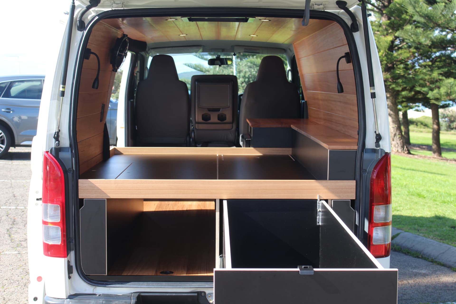 Hiace 200 Series Weekender — Full rear view with the bed platform and drawer open