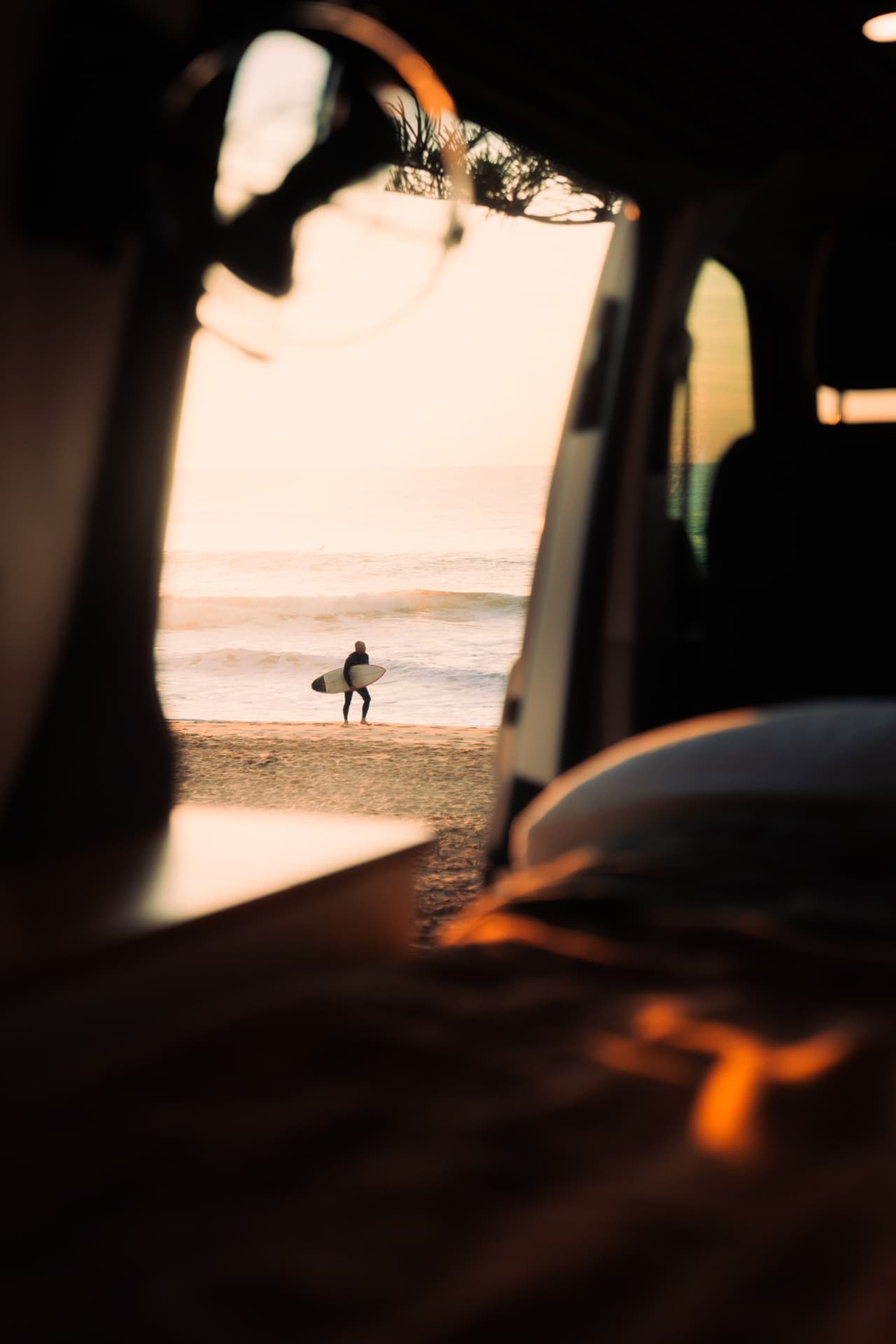 VW Transporter — Surfer framed through the open side door