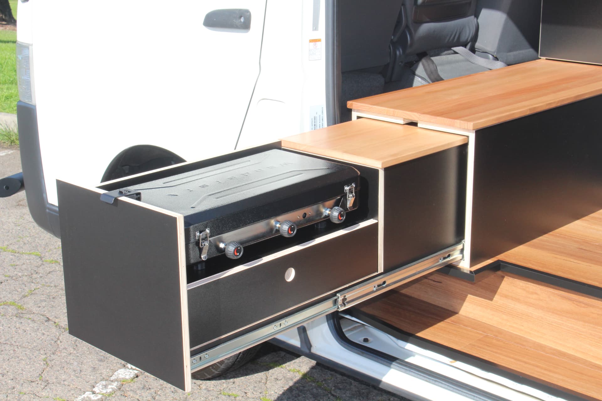 Hiace 200 Series Weekender — Cooker drawer slid out through the side door