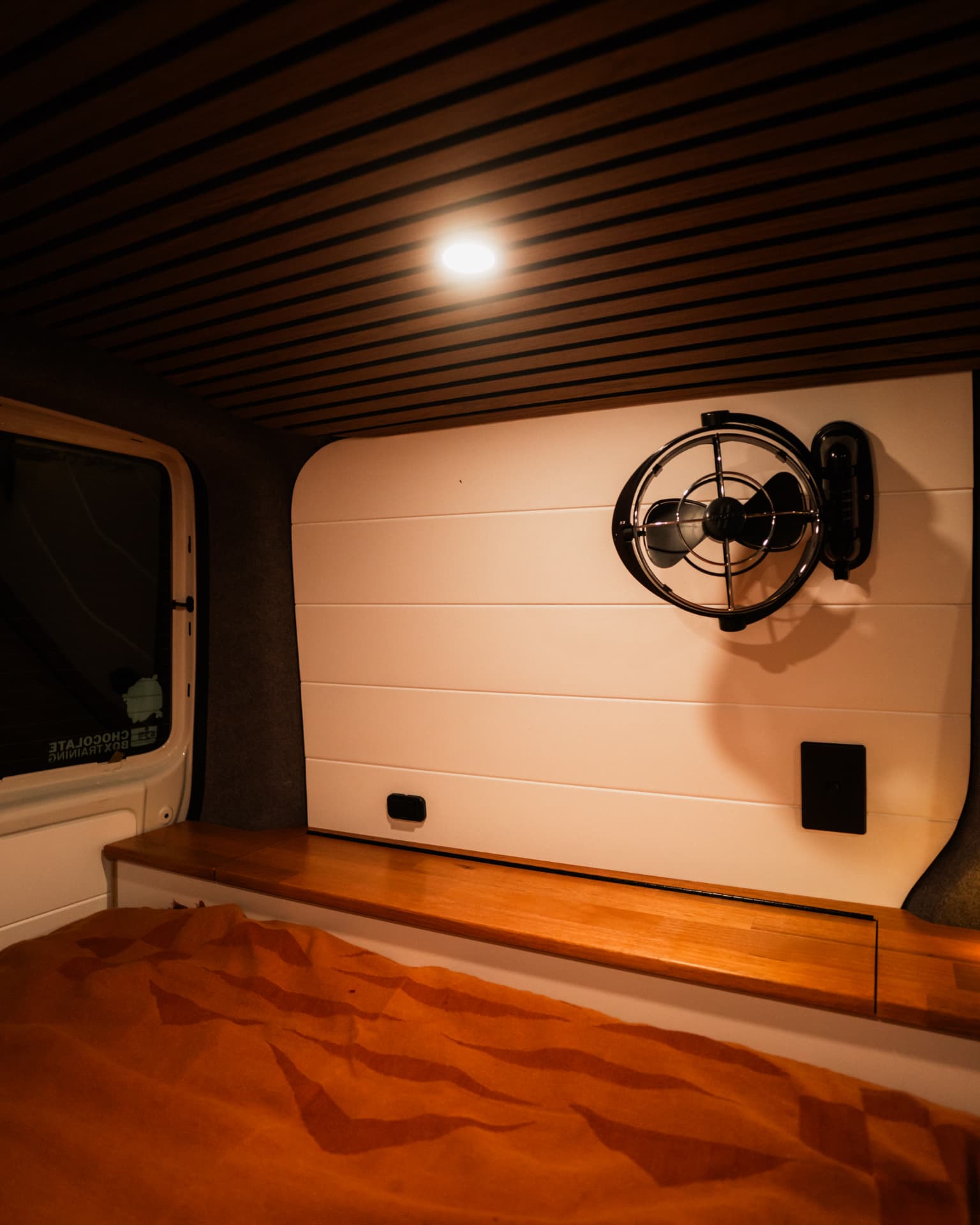 VW Transporter — Sirocco fan on the cream lined wall