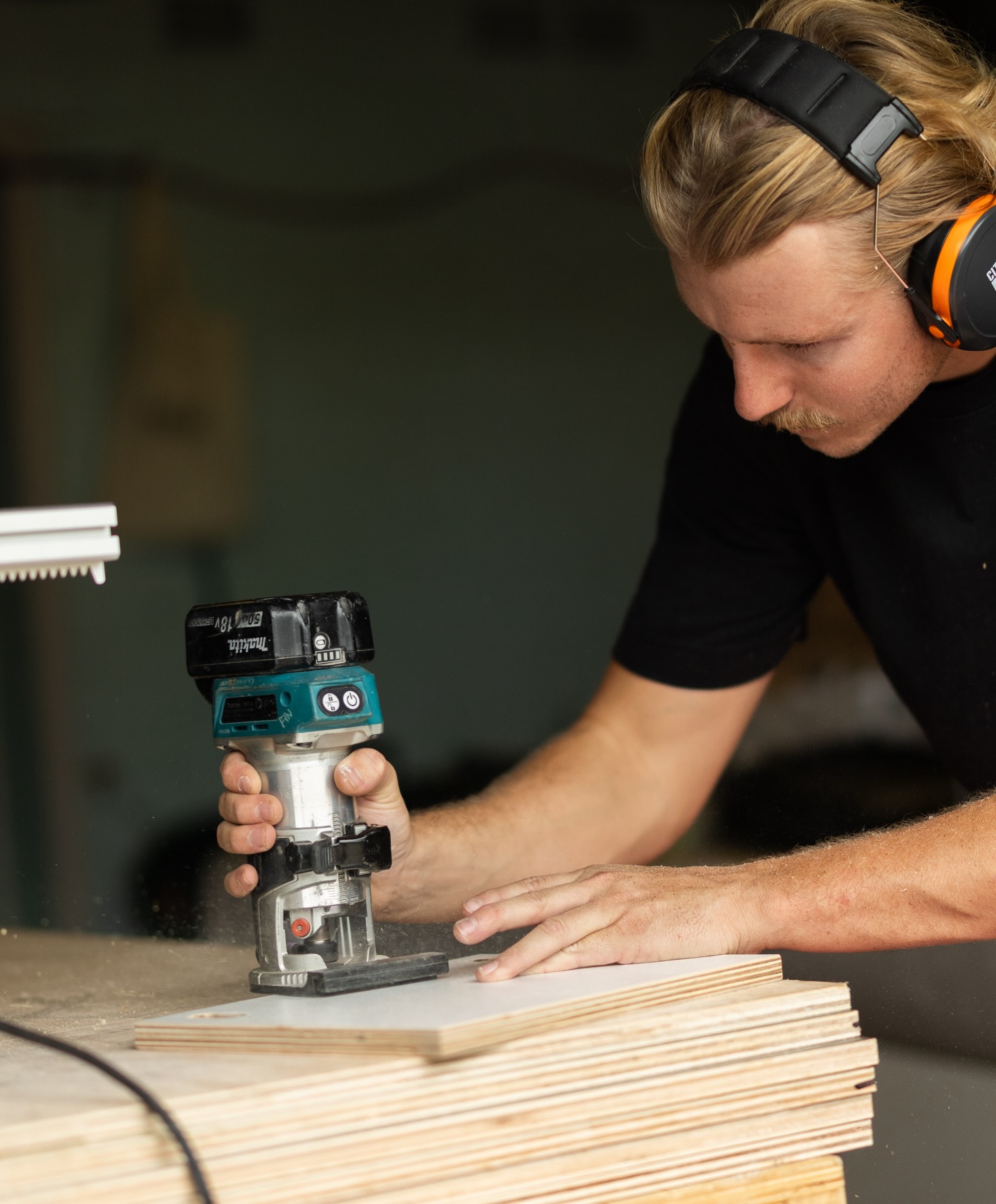 Fin routing a ply panel in the Cronulla workshop