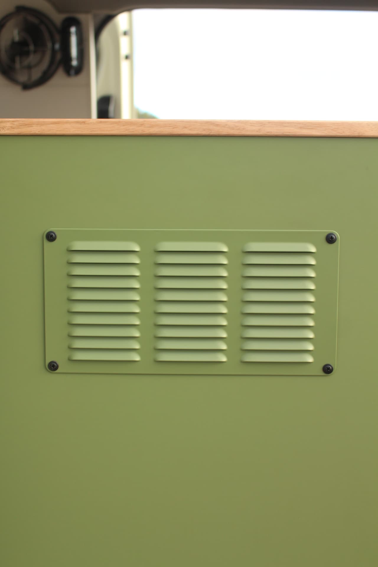 Toyota Hiace 300 Series — Powder-coated louvre vent, colour-matched to the cabinetry
