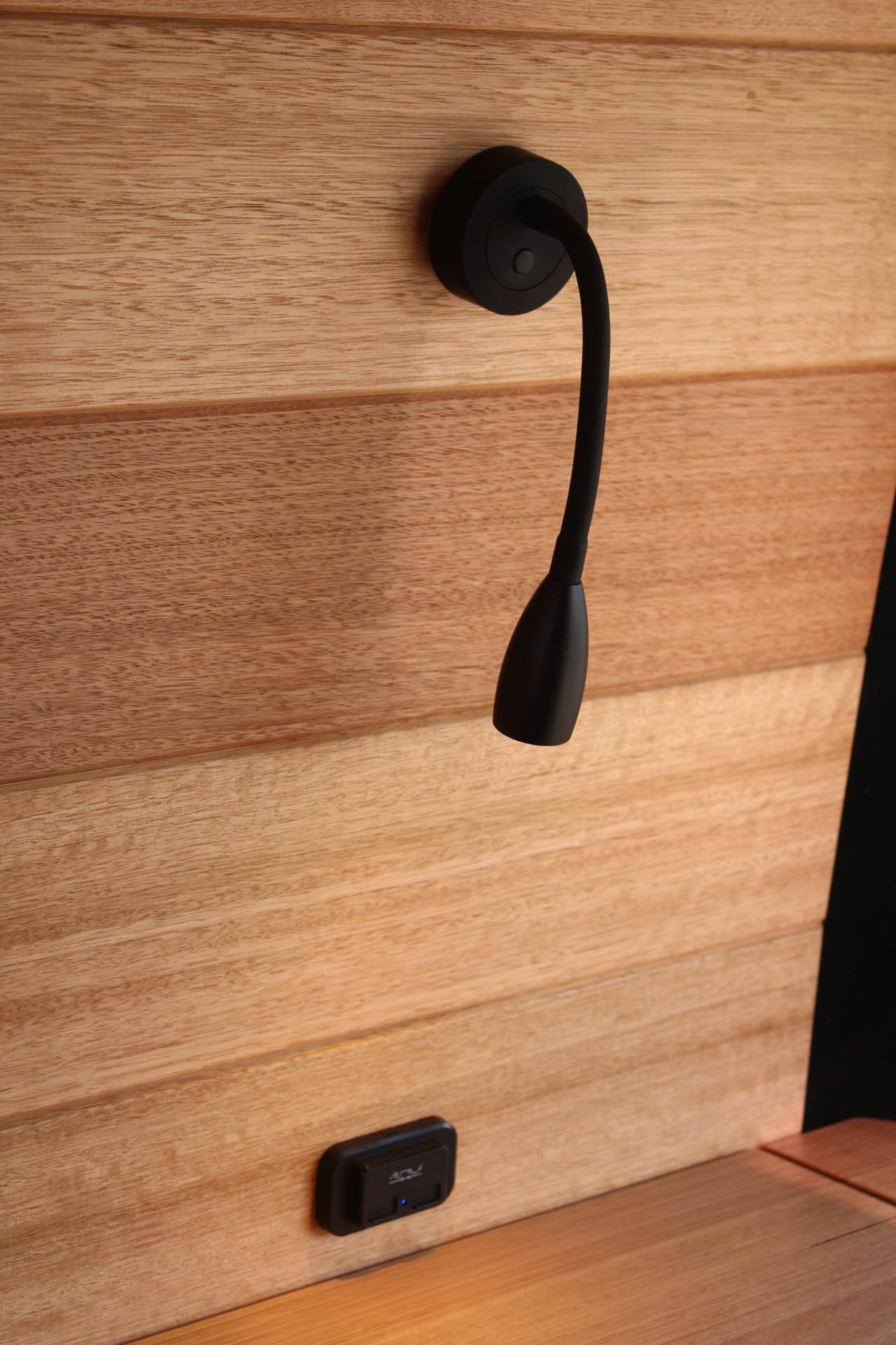 Hiace 200 Series Weekender — Gooseneck light and charging point above the bench