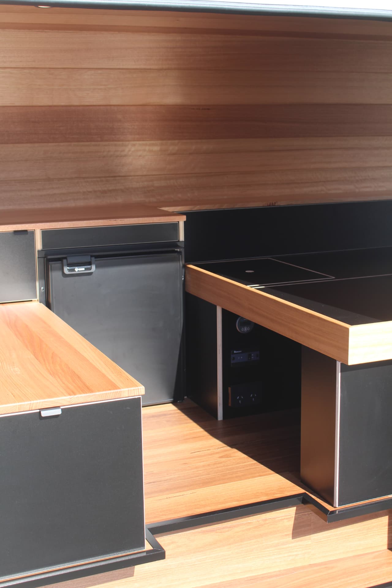 Hiace 200 Series Weekender — Kitchen bench and step-down detail