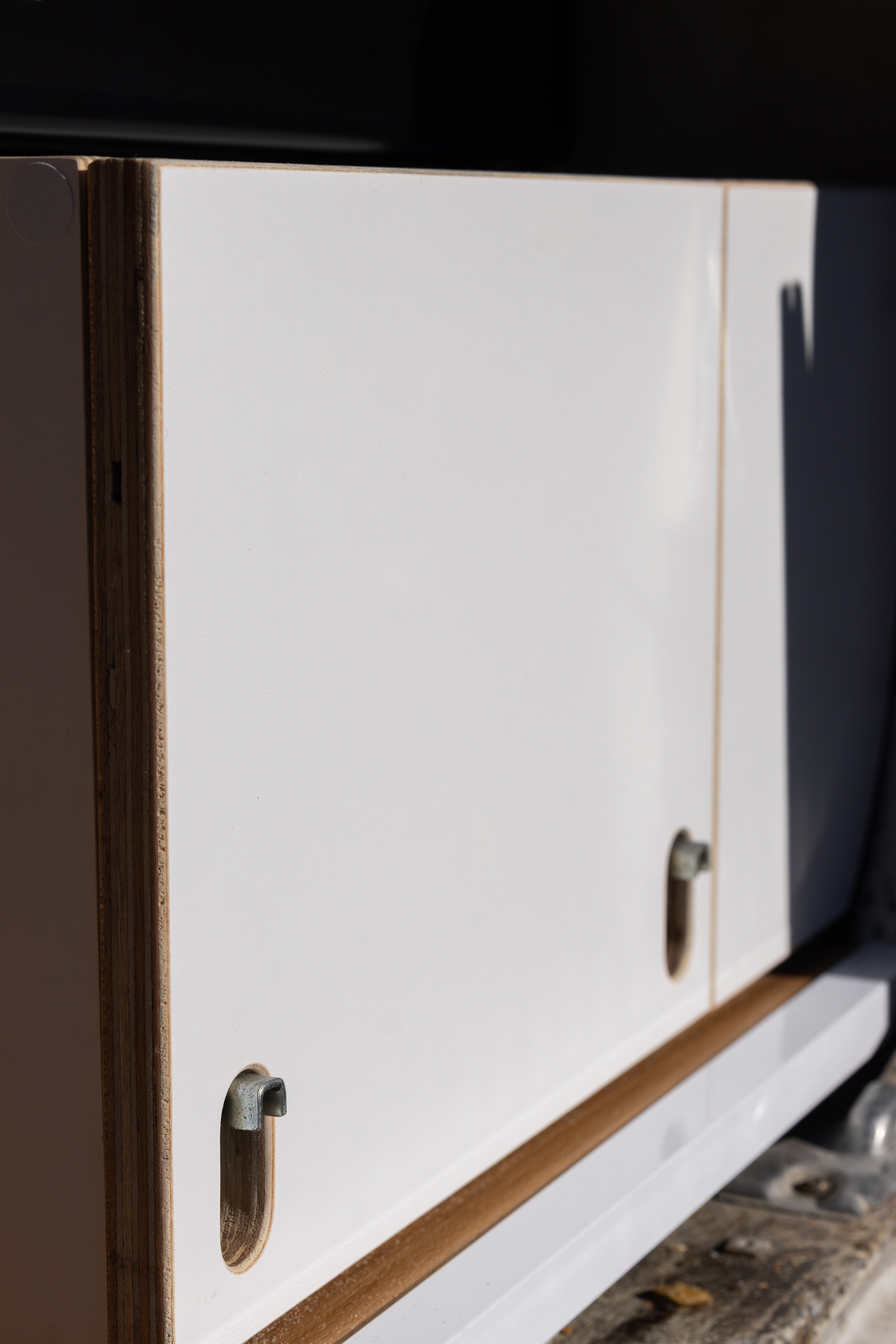 Toyota Troop Carrier — White cabinet doors with brass hardware