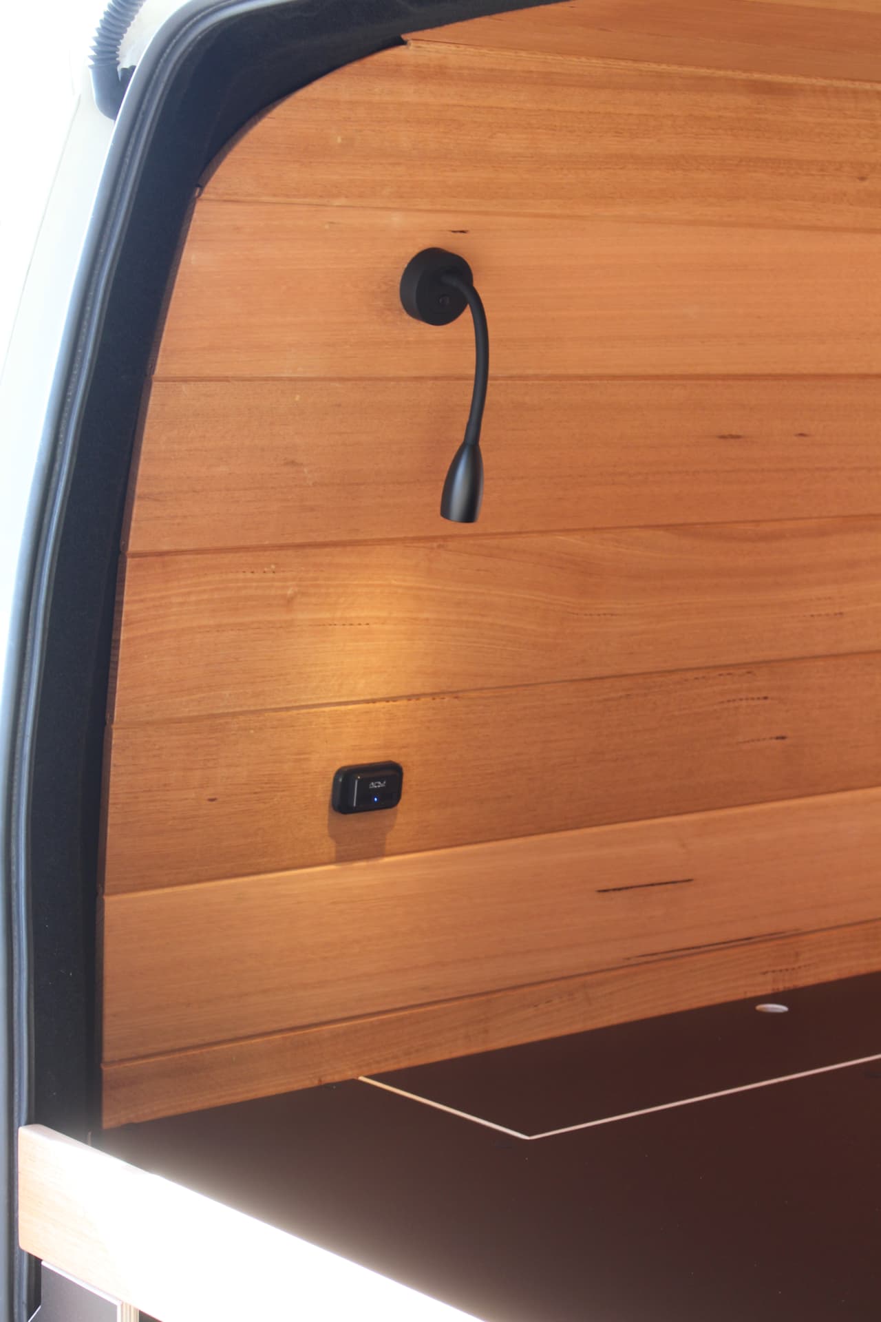 Hiace 200 Series Weekender — Reading light and USB point on the timber lining