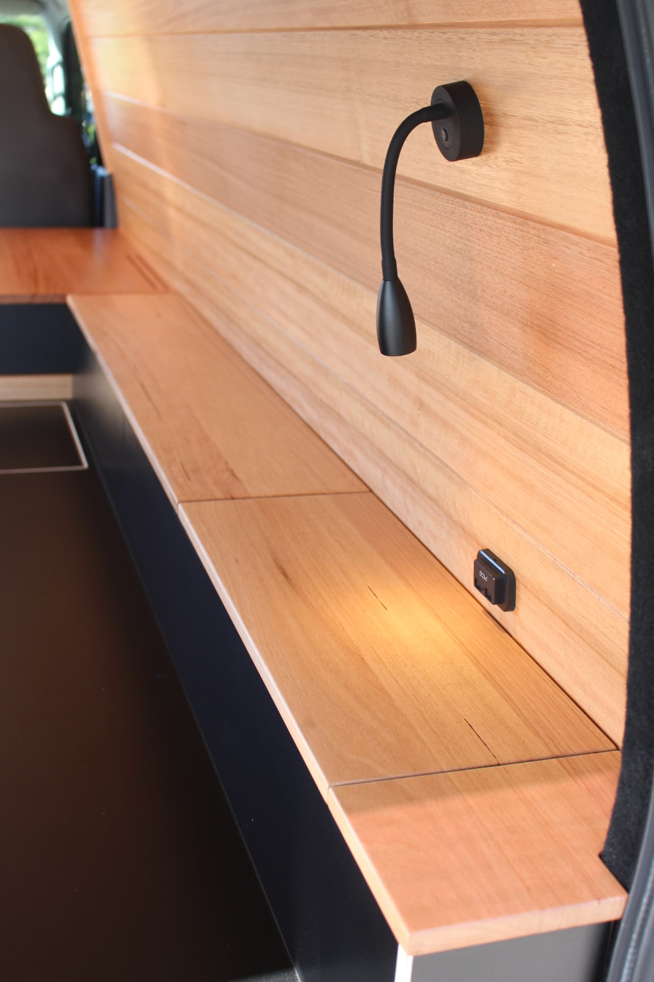 Hiace 200 Series Weekender — Gooseneck reading light over the timber shelf