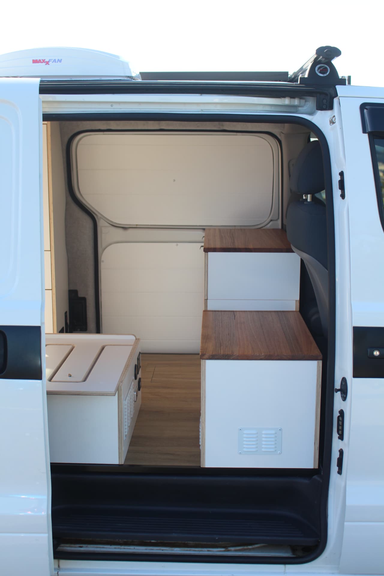 iLoad Camper — Side door open with fridge and bench