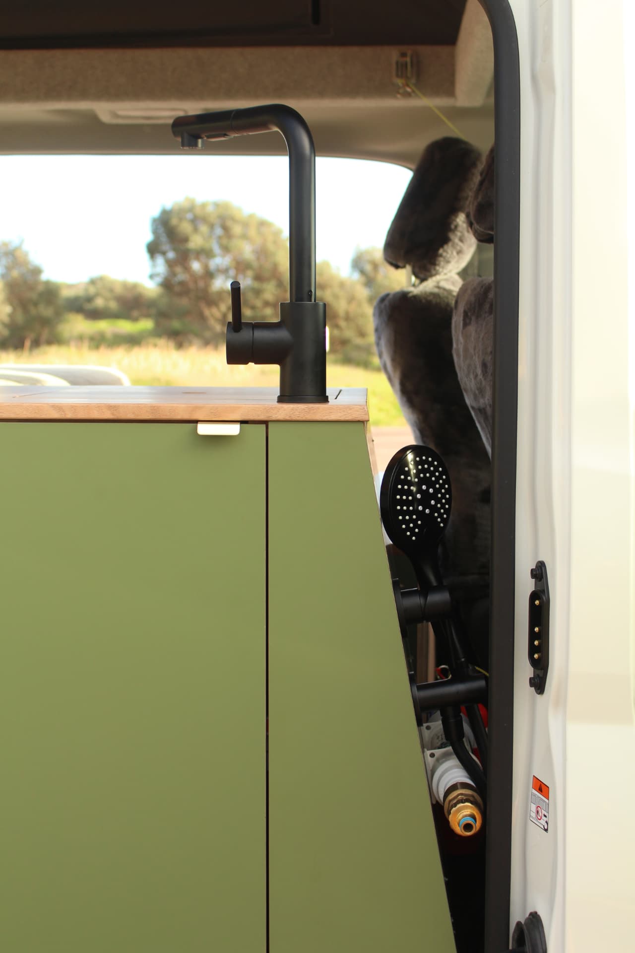 Toyota Hiace 300 Series — Outdoor shower fitting at the side door