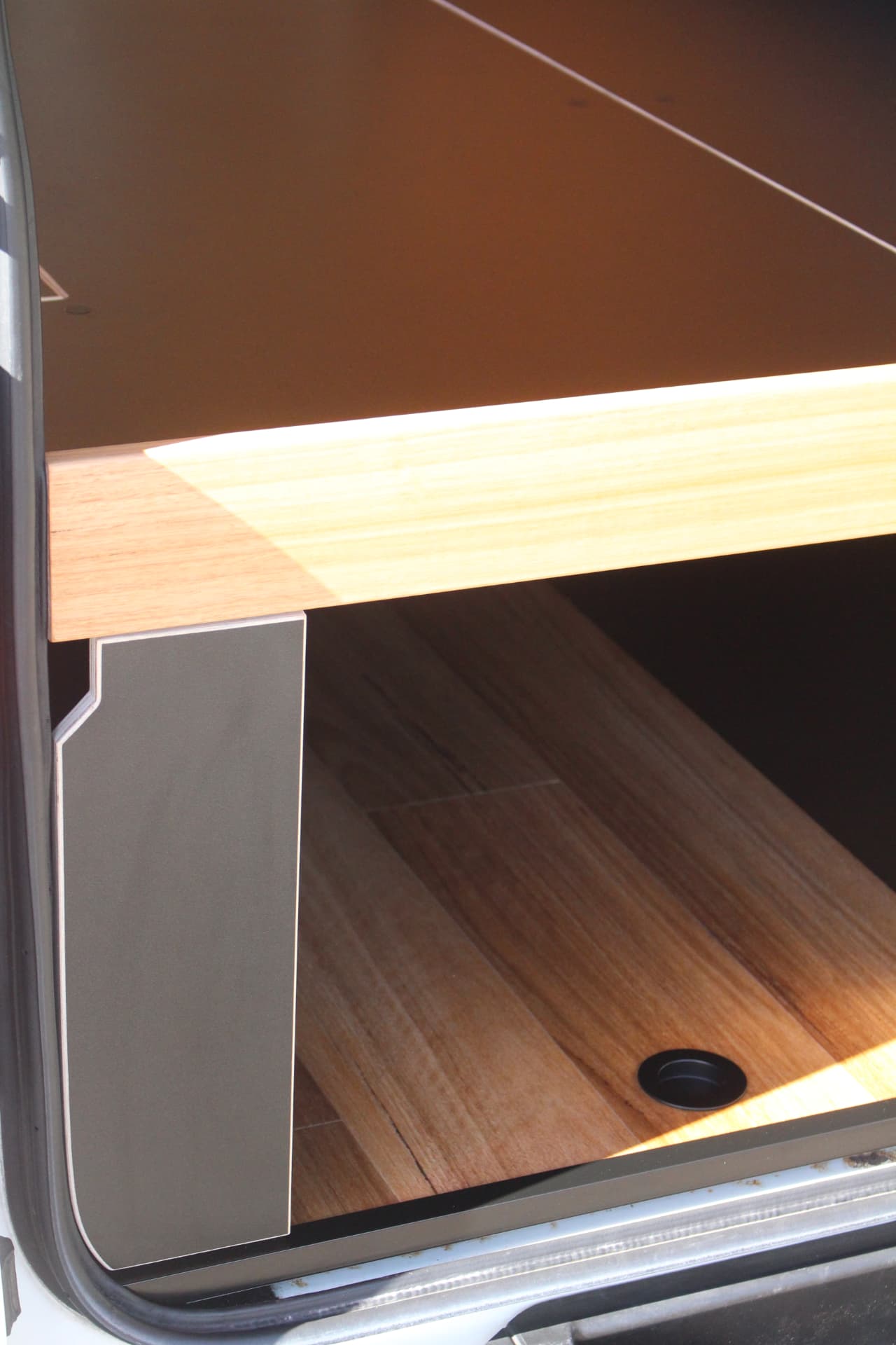 Hiace 200 Series Weekender — Shaped black end panel and benchtop edge